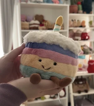 A photo of Amuseables Rainbow Birthday Cake - Medium Jellycat taken by nelesjellycorner