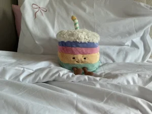 A photo of Amuseables Rainbow Birthday Cake - Medium Jellycat taken by NaanaB15