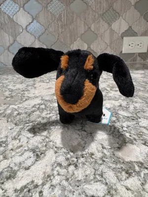 A photo of Freddie Sausage Dog - Small Jellycat taken by SnowLeopard821