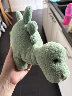 A photo of Fossilly Stegosaurus - Medium Jellycat taken by Natashajade