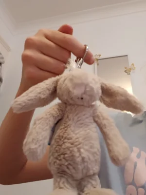 A photo of Bashful Beige Bunny Bag Charm Jellycat taken by Ameliaj2015