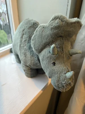 A photo of Fossilly Triceratops - Medium Jellycat taken by Natashajade