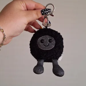 A photo of Amuseables Black Hole Bag Charm Jellycat taken by gaia