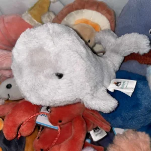 A photo of Wavelly Whale - Grey Jellycat taken by Tiff
