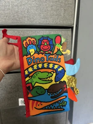 A photo of Dino Tails Book Jellycat taken by averyd2003