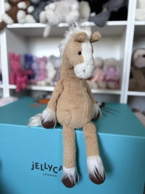 A photo of Pretty Pony Biscuit Jellycat taken by jojokitty