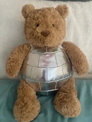 A photo of Bartholomew Bear ‘Disco Ball’ Jellycat taken by annabelle__cate