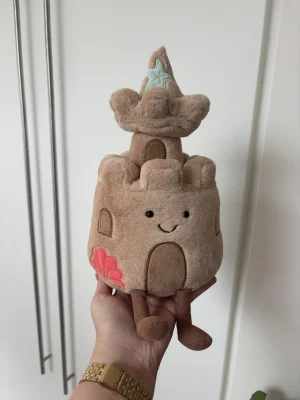 A photo of Amuseables Sandcastle Jellycat taken by the_jelly_jungle