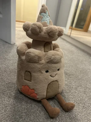 A photo of Amuseables Sandcastle Jellycat taken by GabbyCaEve