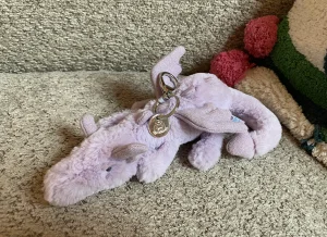 A photo of Lavender Dragon Bag Charm Jellycat taken by JellyDragonLover