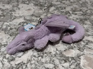 A photo of Lavender Dragon Bag Charm Jellycat taken by SnowLeopard821