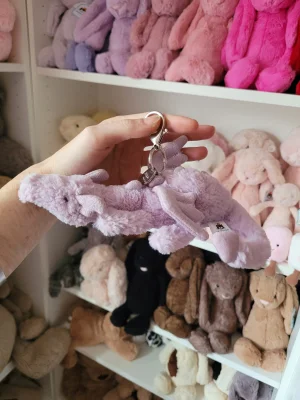 A photo of Lavender Dragon Bag Charm Jellycat taken by Kitsfae