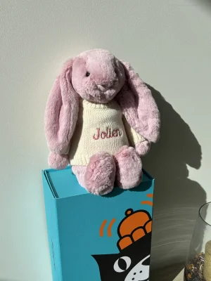 A photo of Bashful Tulip Pink Bunny with Personalised Cream Jumper Jellycat taken by the_jelly_jungle