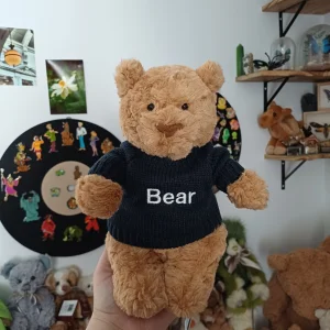 A photo of Bartholomew Bear with Personalised Navy Jumper Jellycat taken by herbgardenplush