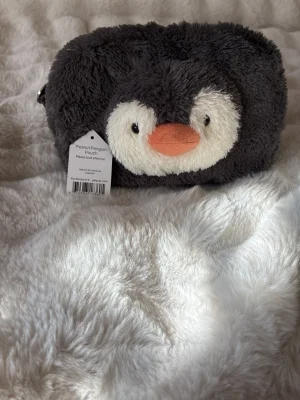 Peanut Penguin Pouch Jellycat photo