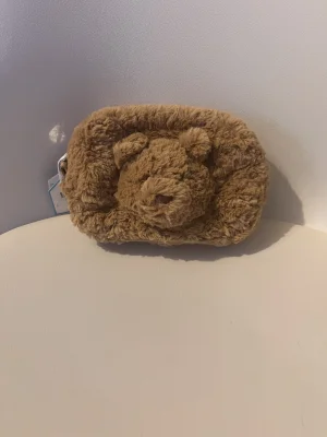 Bartholomew Bear Pouch Jellycat photo
